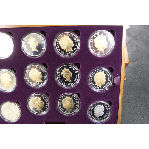 133 - 2002 Golden Jubilee silver proof coin collection comprising 24 crown sized issues mostly gold accent... 