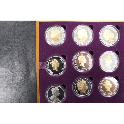 133 - 2002 Golden Jubilee silver proof coin collection comprising 24 crown sized issues mostly gold accent... 