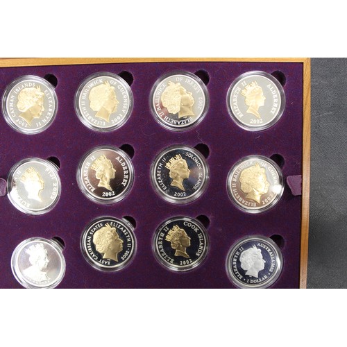 133 - 2002 Golden Jubilee silver proof coin collection comprising 24 crown sized issues mostly gold accent... 