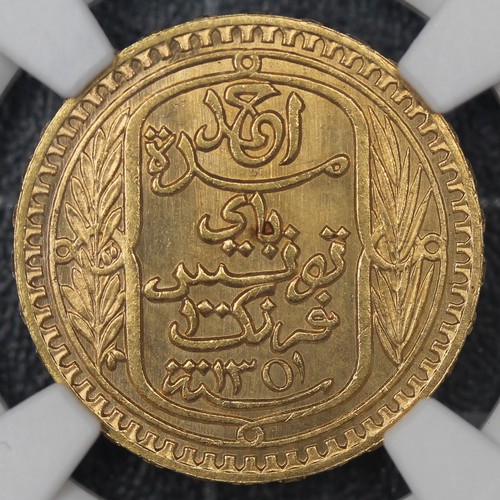 2034 - Tunisia 1932 gold 100 Francs. AH1351 date struck under French protectorate. Graded NGS MS64, bright ... 