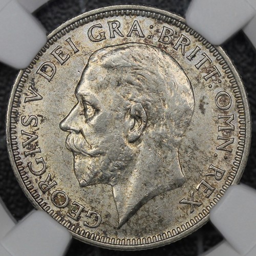 81 - 1928 Shilling, George V. Obv. bare head facing left, Rev. lion passant on crown. Graded NGC AU58. EF... 