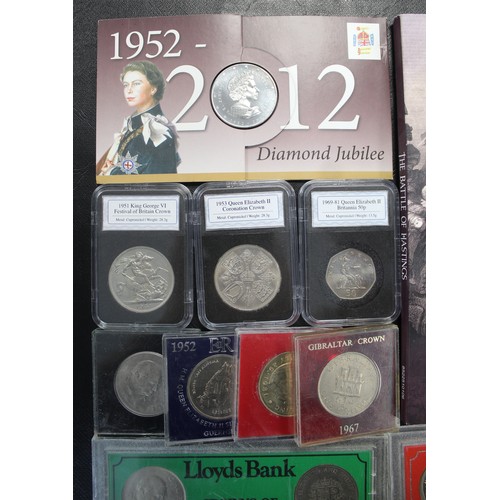 1 - A large assortment of commemorative coins and medals including £5 coins, crowns, presentation folder... 