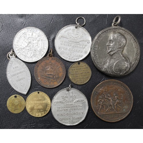 71 - A selection of UK & World medals and tokens (10). Generally base or white metals and covering a ... 