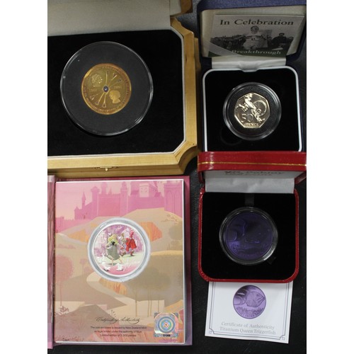 304 - A mix of UK & territory coins and medals in base metal and silver to include TDC gold plated sil... 