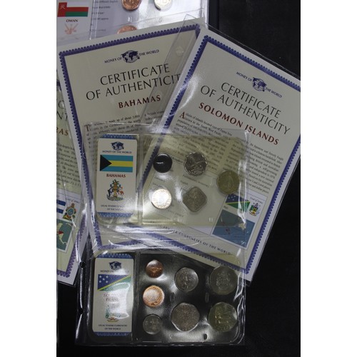 318 - Coins of the World, an assortment of BUNC circulating coinage from 35 countries in sealed packs with... 