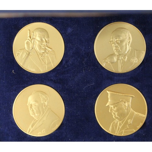 249 - A set of four sterling silver Winston Churchill medals finished in 24ct gold by John Pinches c.1974.... 