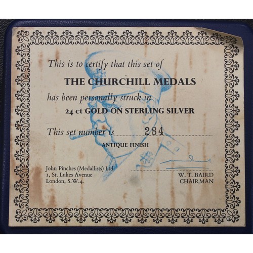 249 - A set of four sterling silver Winston Churchill medals finished in 24ct gold by John Pinches c.1974.... 