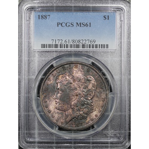 304 - USA, 1887 Morgan Dollar. Philadelphia mint. Graded PCGS MS61 with heavy mottled toning over plentifu... 