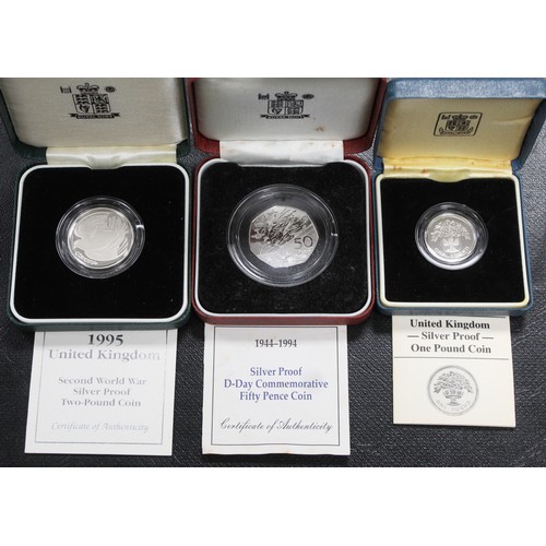 163 - Silver proof coins (3) comprising 1995 WWI £2, 1994 D-Day 50p & 1987 £1 coin. All as... 