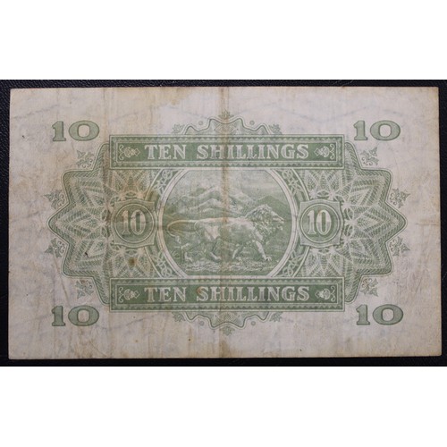 6 - The East Africa Currency Board, 1955 10 Shillings. Elizabeth II. VF, stained & folded now straig... 