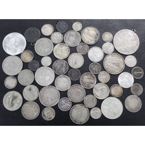 304 - A selection of predominantly silver world coins  totalling approx. 300g. Mixed grades, a few mounted... 