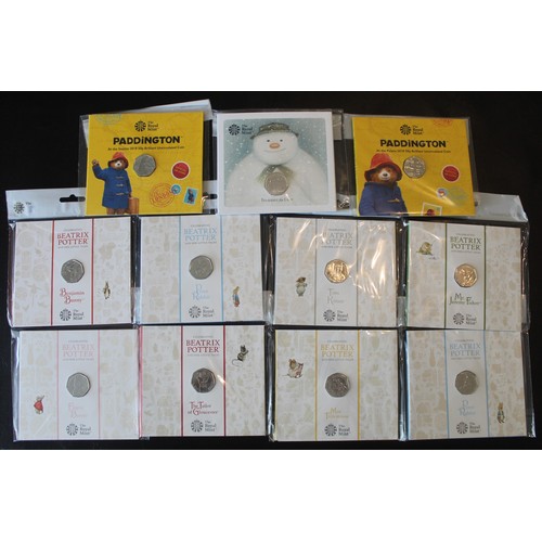 239 - An assortment of BUNC 50p's (11) all with a children's theme comprising 2018 Snowman, 2018 Paddingto... 