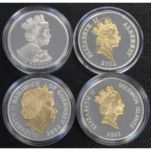 251 - 2002 Silver proof £5 coins from the UK, Alderney, Guernsey & Solomon Islands. A part set from th... 