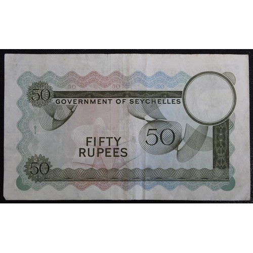 18 - Seychelles 1972 50 Rupee, Elizabeth II. A number of folds and some light staining. Minor tear to top... 