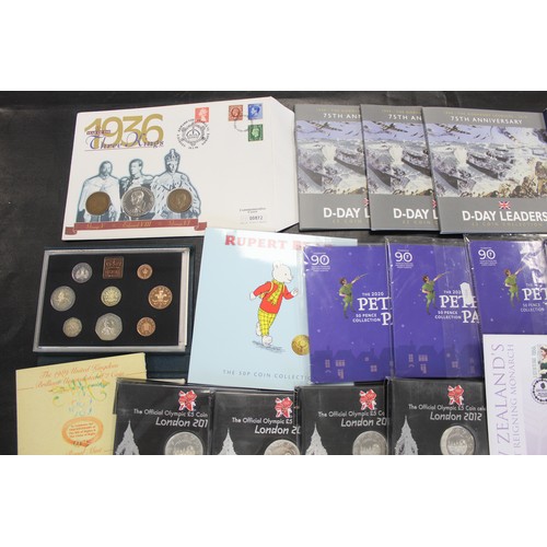 416 - An extensive offering of mainly BUNC coins and sets (43) of varied interest. Includes a mix of UK an... 