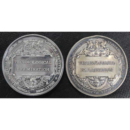 420 - A pair of silver City & Guilds Technological Examination medals dated 1889 & 1926. The earli... 