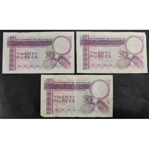 9 - Seychelles, a trio of 1971 20 Rupee banknotes, Elizabeth II. All with multiple folds and occasional ... 