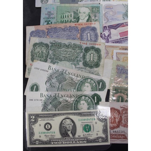 19 - Approximately 100 UK & world banknotes in mixed conditions to include two wrapped and aUNC £1 se... 