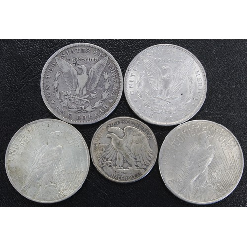 324 - Coins of America, silver dollars and half dollars (5) including 1879 Morgan dollar, 1880 Morgan doll... 