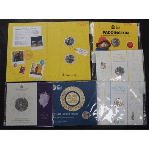 275 - A selection of BUNC coins (7) to include 2023 Coronation £5, 2016 Last Round £1, 2018 Peter Rabbit, ... 