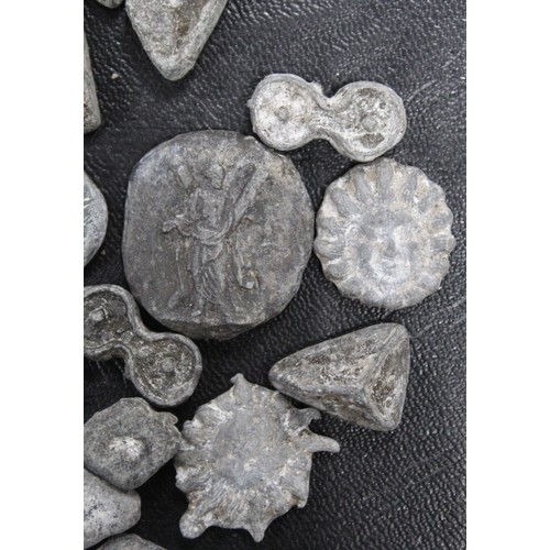 187 - A miscellaneous assortment of lead plaquettes. Of unknown origin or reason they form a variety of si... 