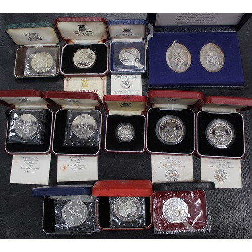 299 - An assortment of silver and silver proof coins and medals (12 packs) including a range of Territory ... 