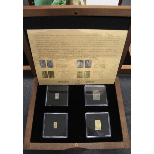 320 - A pair of oriental coin sets including 