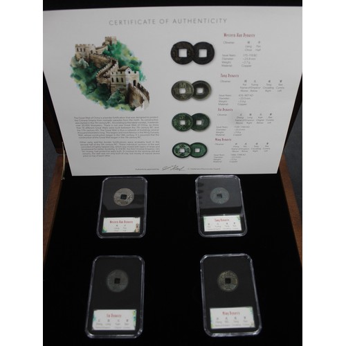 320 - A pair of oriental coin sets including 