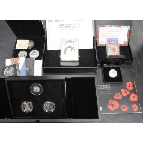 300 - An assortment of silver and base metal coins all with a military theme (10) including VE Day 75th An... 