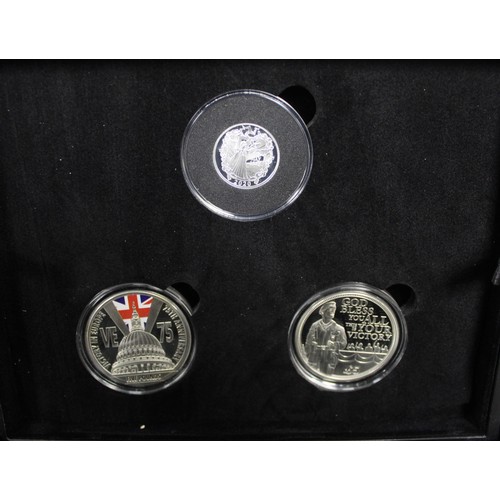 300 - An assortment of silver and base metal coins all with a military theme (10) including VE Day 75th An... 