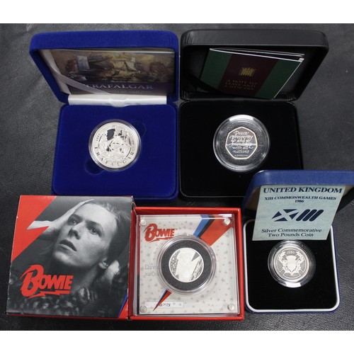 300 - Silver proof coin assortment (4) comprising 2020 David Bowie ½oz Music Legend series, 2005 Battle of... 