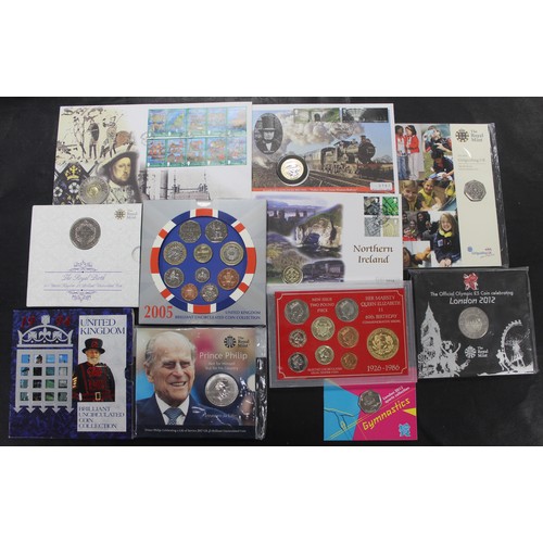 256 - An assortment of mainly BUNC coins and year sets in Royal Mint packs and PNC/FDC's to include Olympi... 