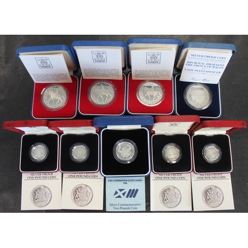 301 - An assortment of silver proof coins (9) comprising 1977 silver jubilee crowns (3), 1981 crown, 1986 ... 