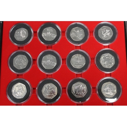 241 - A selection of 40 BUNC 50p coins from UK and Territories to include 2019 Military 5-coin set, Tales ... 