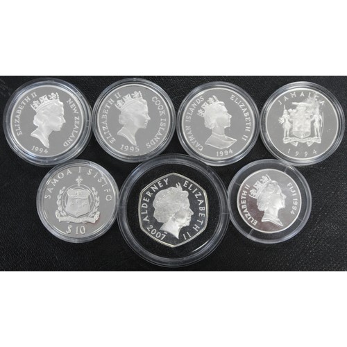 319 - World silver proof coin assortment (7) comprising Alderney 2007 hexagonal £5, Cayman Islands 1994 $1... 