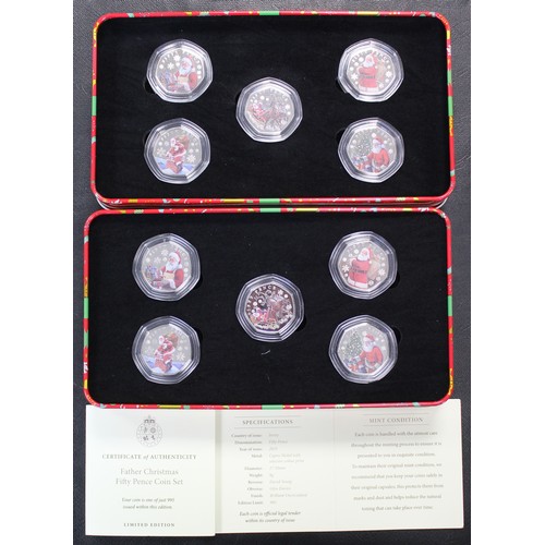 256 - A pair of Jersey 2023 Father Christmas 5-coin BUNC set with colour finish, each presented in Christm... 