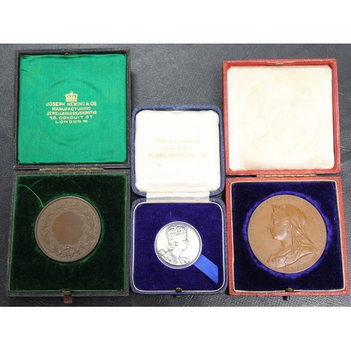 26 - A small assortment of cased medals (3) comprising official 1897 Diamond Jubilee medal in copper, an ... 