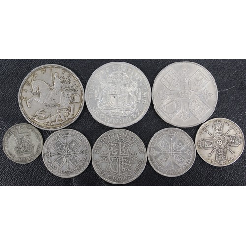 301 - A mixed assortment of pre-1947 silver coins comprising crowns, halfcrown, florins and shilling. Mixe... 