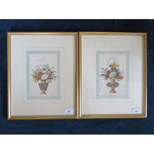 24 - A pair of silk pictures depicting baskets of flowers.