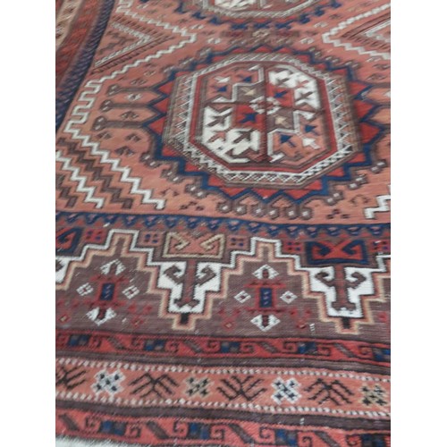 163 - A red ground rug approx 228cm x 106cm