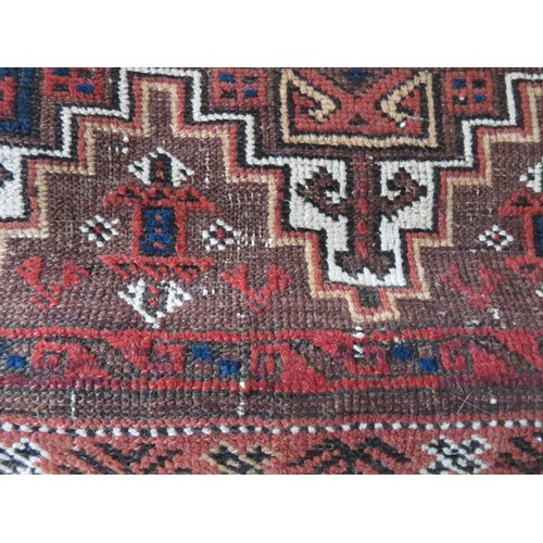 163 - A red ground rug approx 228cm x 106cm
