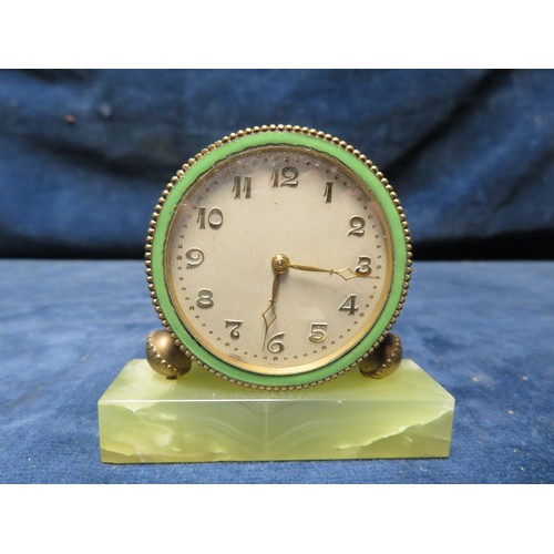 176 - A travel clock on green base with case