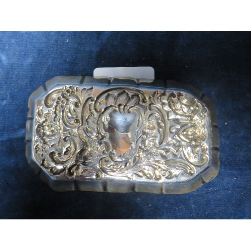 191 - A small silver pin tray with embossed decoration, 11.5cm x 7cm, hallmarked London, weighing approxim... 