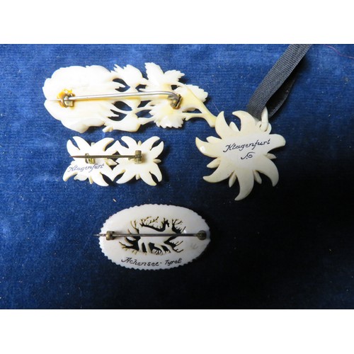 194 - A box of bone and other jewellery including 2 brooches and a set comprising brooch and necklace with... 