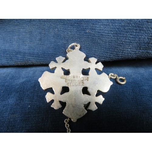 203 - A Sterling silver Cross Pendant with chain, marked Jerusalem, a pair of cufflinks marked 