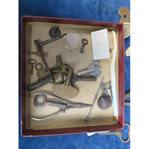 233 - A sundry lot including finials, keys, spares, clock sundries, etc.,