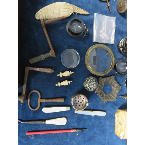 233 - A sundry lot including finials, keys, spares, clock sundries, etc.,