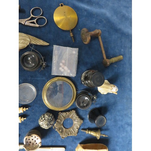 233 - A sundry lot including finials, keys, spares, clock sundries, etc.,