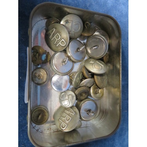 240 - A tin of buttons including A.R.P. and C.D., etc.,