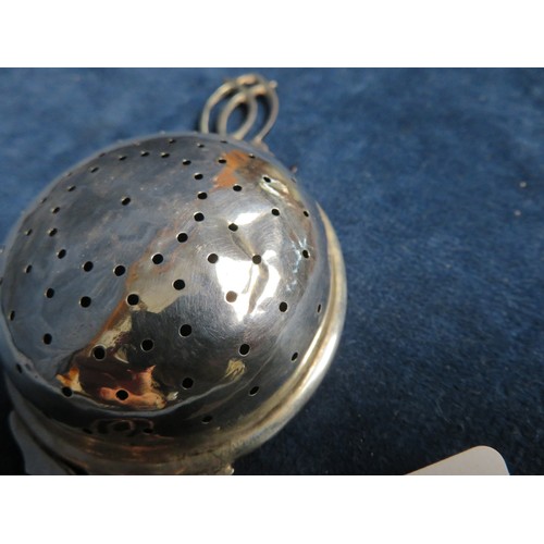 305 - A small pierced silver tea strainer hallmarked Sheffield 1920.